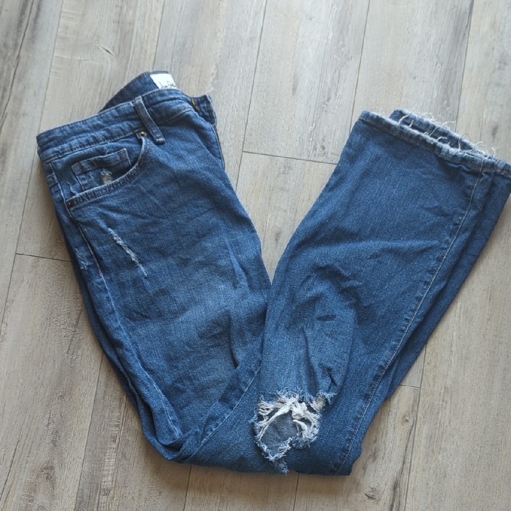 Distressed Blue Denim Jeans